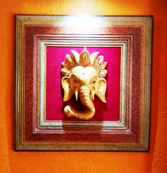 Wall hanging made from hard dye board and Nepali Lokta paper with lord Ganesh framing.
