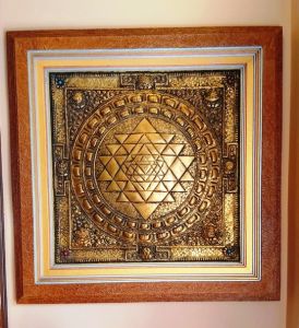 Wall hanging made from hard dye board and Nepali Lokta paper with metal framing in it.